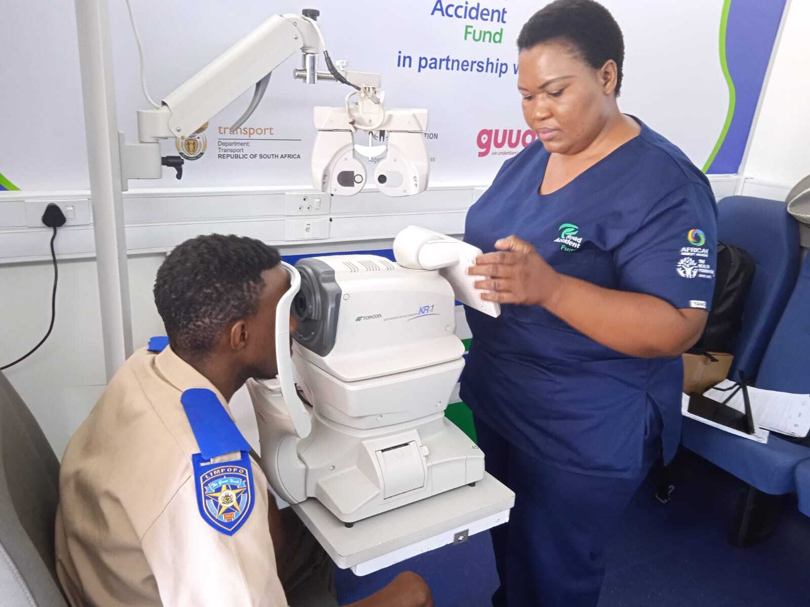 Nurse performing an eye test on a patient